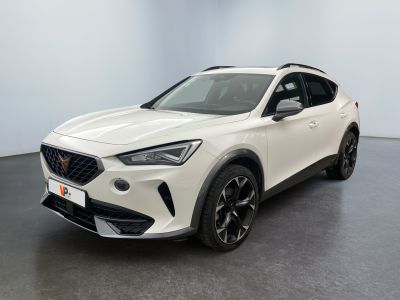 a white car parked in a room with a black floor