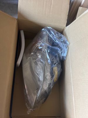 a cardboard box with a plastic bag inside of it