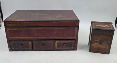 two wooden boxes and a small box on a white surface