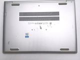 a silver laptop with a small hole in the back