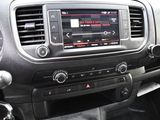 a car dashboard with a clock and radio in it