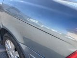 a car that is parked on the side of the street