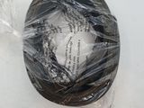 a black wire wrapped in plastic on top of a white table