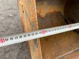 a measuring tape that is on the side of a piece of machinery