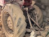 a large tractor that is sitting in the dirt