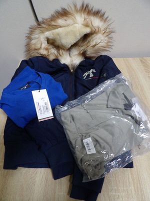 a pile of clothing sitting on a wooden table