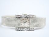 an image of a lady ' s wrist watch with a chain around it