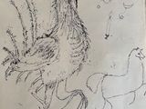 drawing of a chicken on a piece of paper on a table