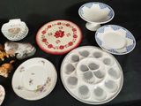 many different plates and bowls on the table