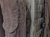 jacket on a mannequin stand with a white shirt and a brown jacket