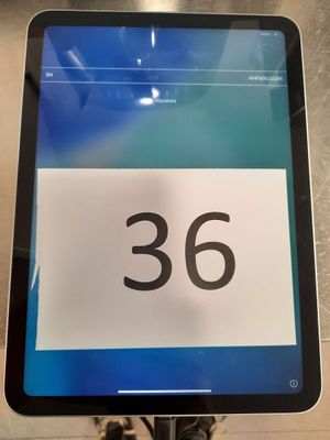 a tablet with a number on it sitting on a table