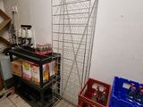 a metal rack that is next to a blue crate