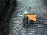 a picture of a car key and remote control in a car