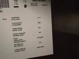 a receipt on a refrigerator door with a barcode on it