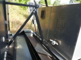 a machine that is sitting in the back of a truck