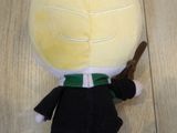 a small stuffed animal that is sitting on the floor
