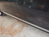 a car that is parked in a garage with a lot of dirt on the floor