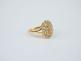 a gold ring with a cluster of diamonds on it