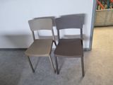 two chairs sitting next to each other in a room