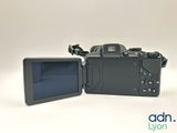 the back of a digital camera with the screen open