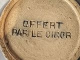 a close up of a plate with a name on it
