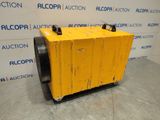 a yellow box sitting on top of a pallet in front of a wall