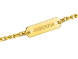 a gold plated bracelet with a name engraved on it