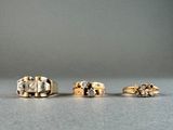 three different types of rings on a table with a gray background