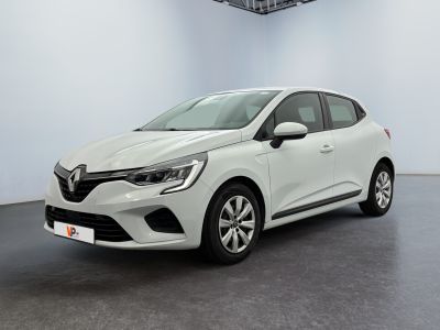 a white car is parked in a room with a checkered ceiling
