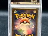 a close up of a pokemon card in a clear plastic case