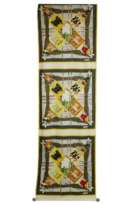 a close up of three quilts hanging on a wall