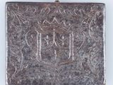 an old silver metal box with an ornate design on it