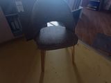 a chair that is sitting in the corner of a room