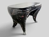 a black and white table with a glass top