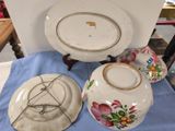 two plates and a bowl sitting on a table