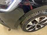 a close up of a car ' s tire with a sticker on it