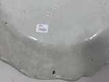 a white plate that has a sticker on it