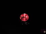 a red diamond on a black background