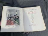 someone is holding a book with a picture of a woman and a man