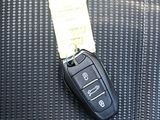 a car key sitting on the seat of a car