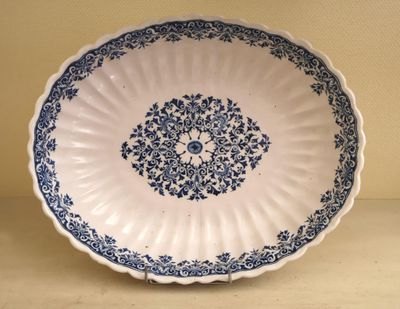 a blue and white plate sitting on a table
