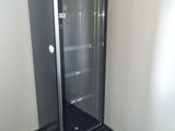 an image of a glass door refrigerator in a room