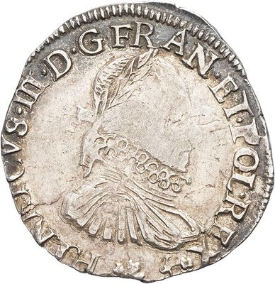a close up of a coin with a bird on it
