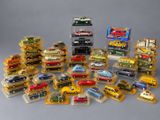 a lot of toy cars that are in a display case