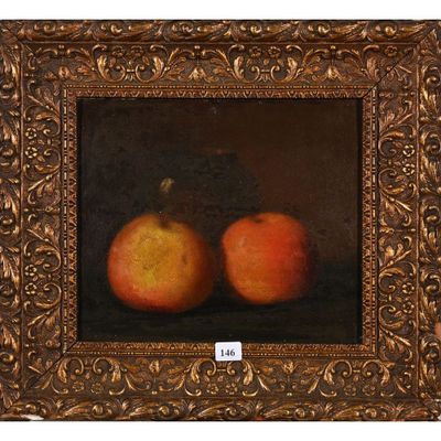 tableau représentant deux pommes dans un cadre doré sur fond noir