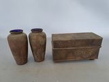 two vases sitting next to each other on a table