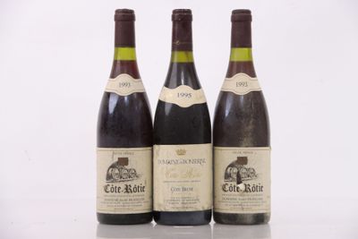 three bottles of wine sitting on top of a table next to each other