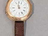 a watch that is sitting on the wall next to a wall