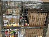 a large metal cage with a bunch of boxes inside of it
