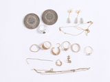 many different types of jewelry on a white surface
